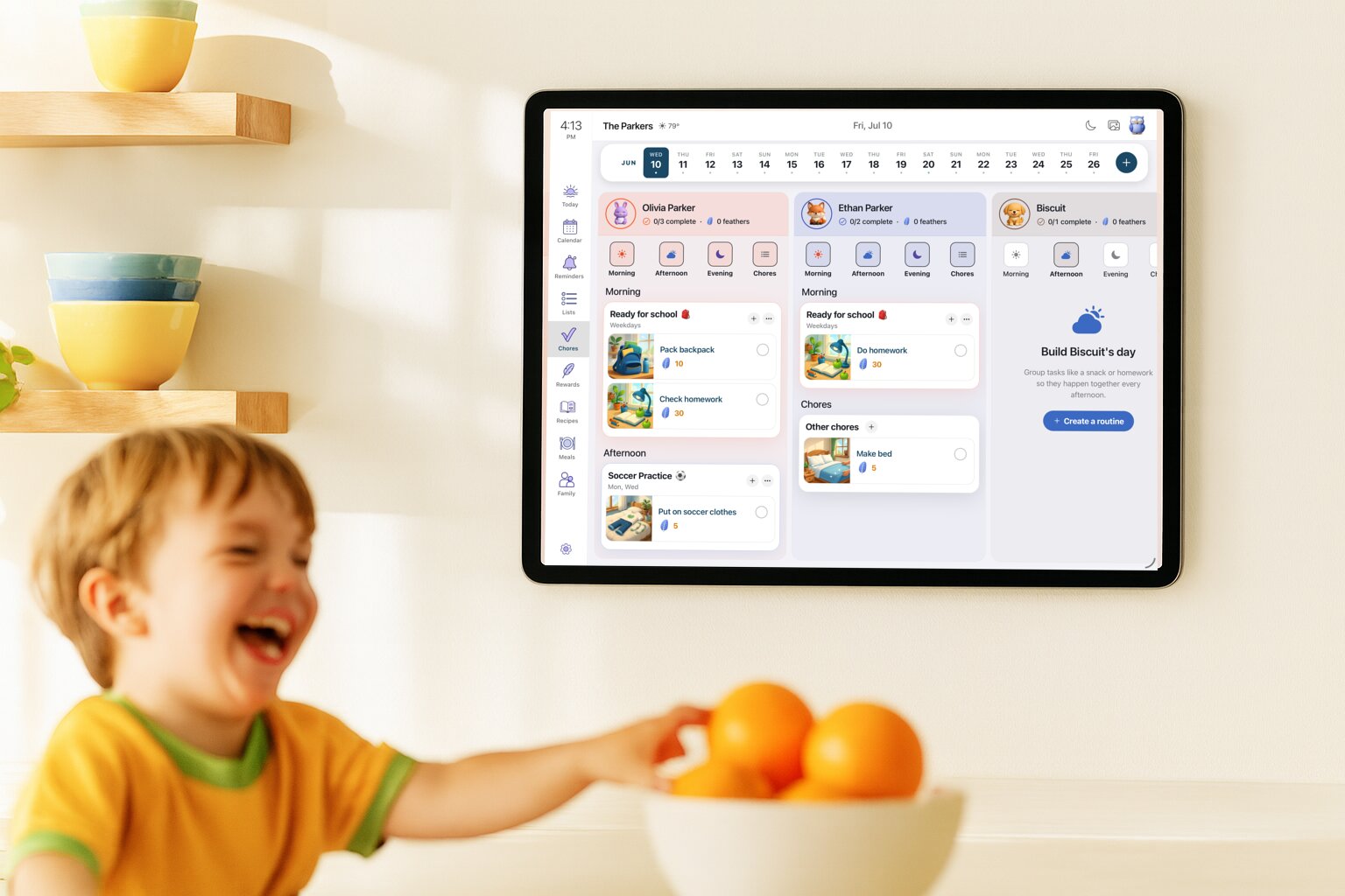 Sense Hub on a wall-mounted tablet in a family kitchen showing everyone's routines for the day